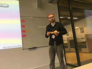 Duncan Stephen placing sticky notes on a whiteboard